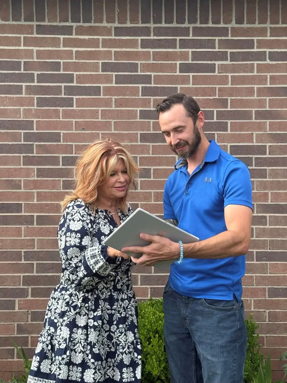 Exterior painting consultation with homeowner